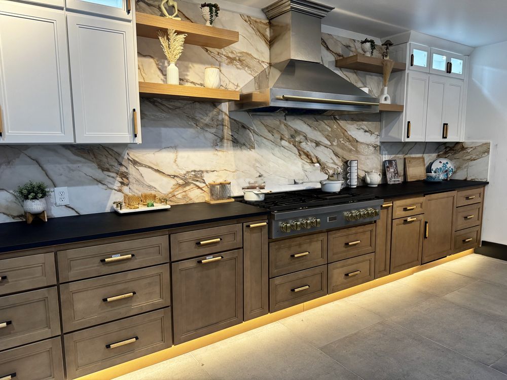 Custom kitchen remodel with book-matched marble backsplash by SummitForge Construction