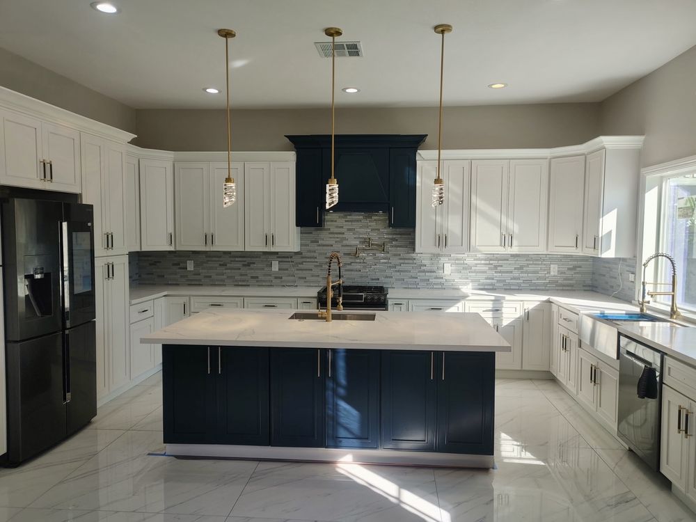 Custom kitchen with navy island by SummitForge Construction