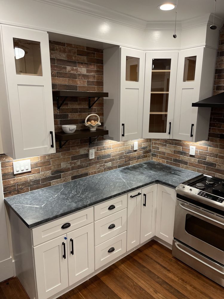 Kitchen remodel with brick backsplash by SummitForge Construction